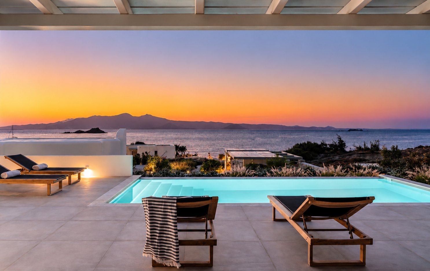 Outdoor lounge overlooking the Naxos landscape at sunset